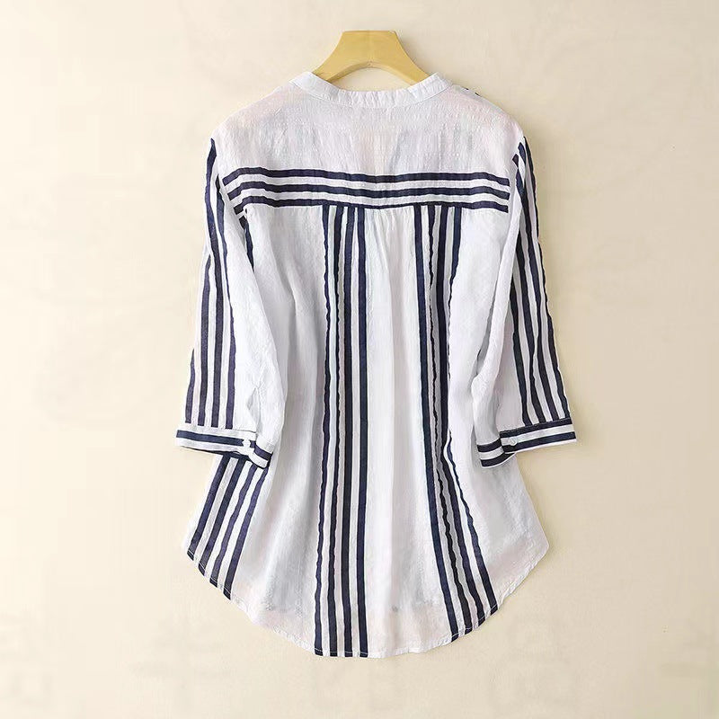 Versatile women's striped button-down shirt. Sophisticated long sleeve top for casual or professional wear. Summer fashion.