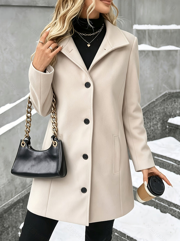 Stylish women's longline winter coat, a chic single-breasted design with a refined notch collar.