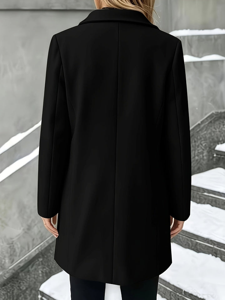 Sleek longline women's single-breasted coat featuring an elegant notch collar, perfect outerwear.