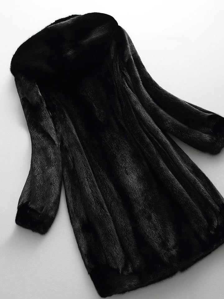 Chic women's longline hooded winter coat, a versatile and elegant piece for sophisticated looks.