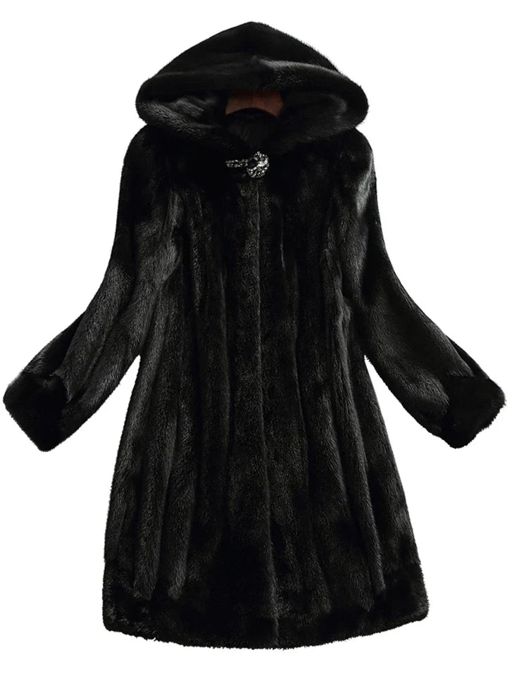 Stylish women's hooded longline coat, perfect for a modern autumn/winter statement. Warm and chic.
