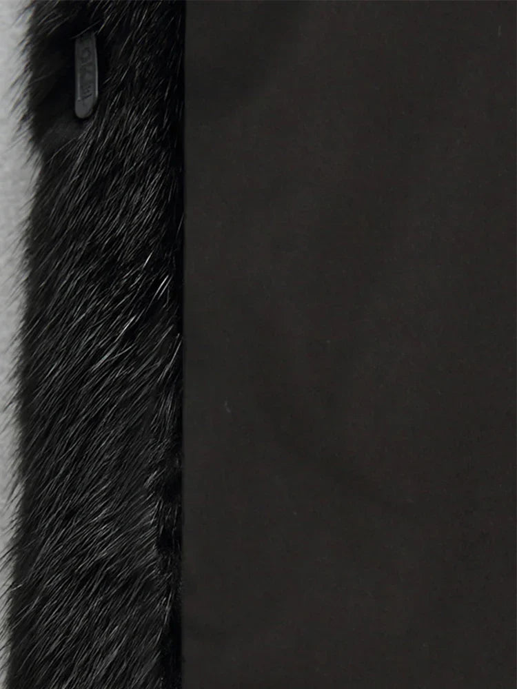 Warm women's longline hooded coat, an elegant and chic choice for sophisticated autumn-winter fashion.