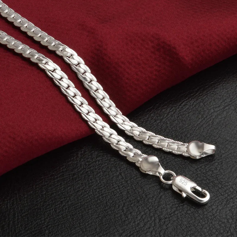 Close-up of elegant women's lucky charm pendant necklace, highlighting intricate detail & design.