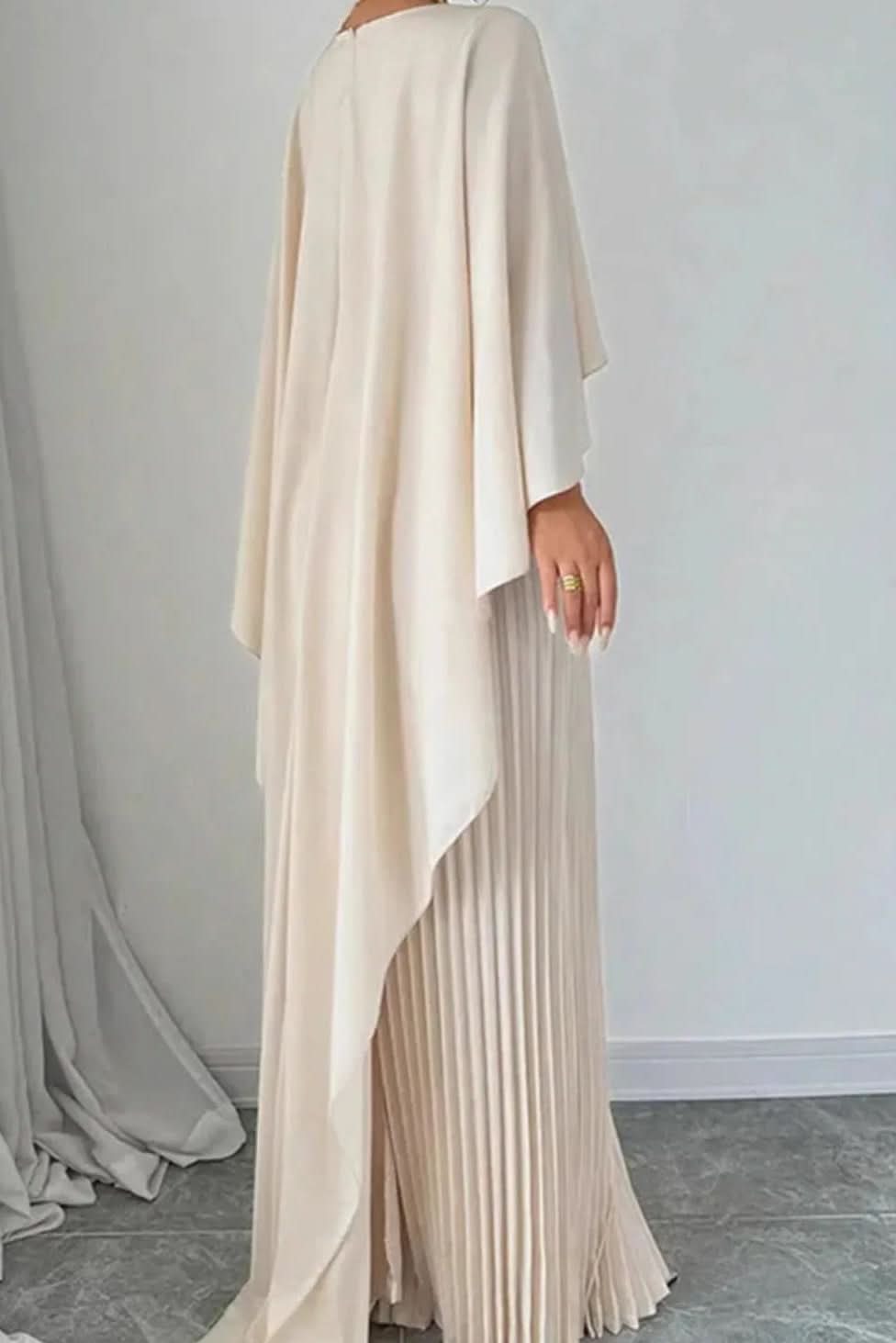 Long pleated maxi dress with flowing cape sleeves for women. Ideal formal occasionwear or evening gown.
