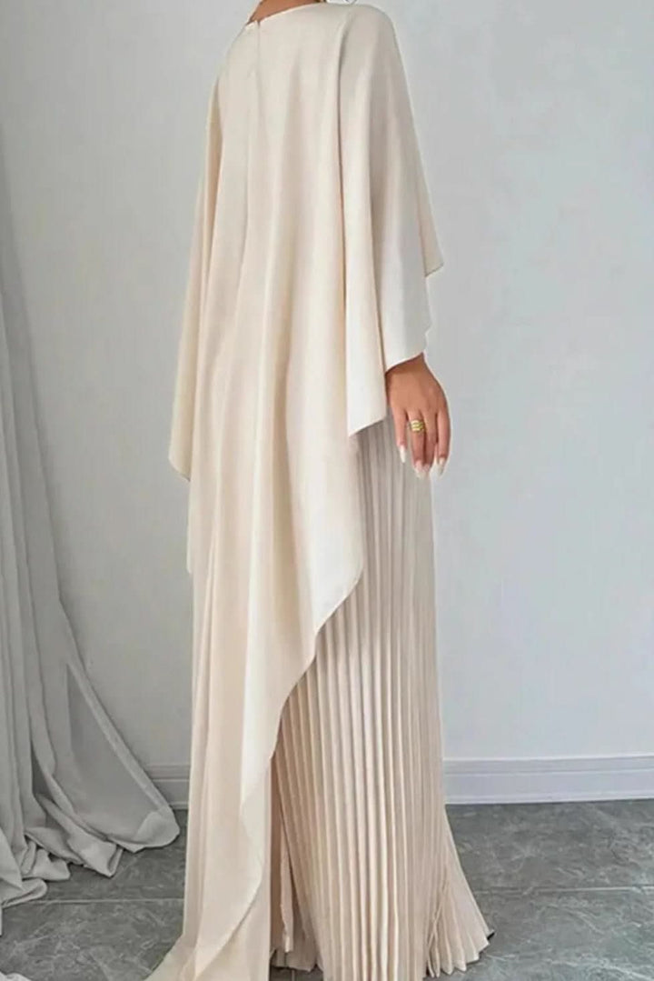 Long pleated maxi dress with flowing cape sleeves for women. Ideal formal occasionwear or evening gown.