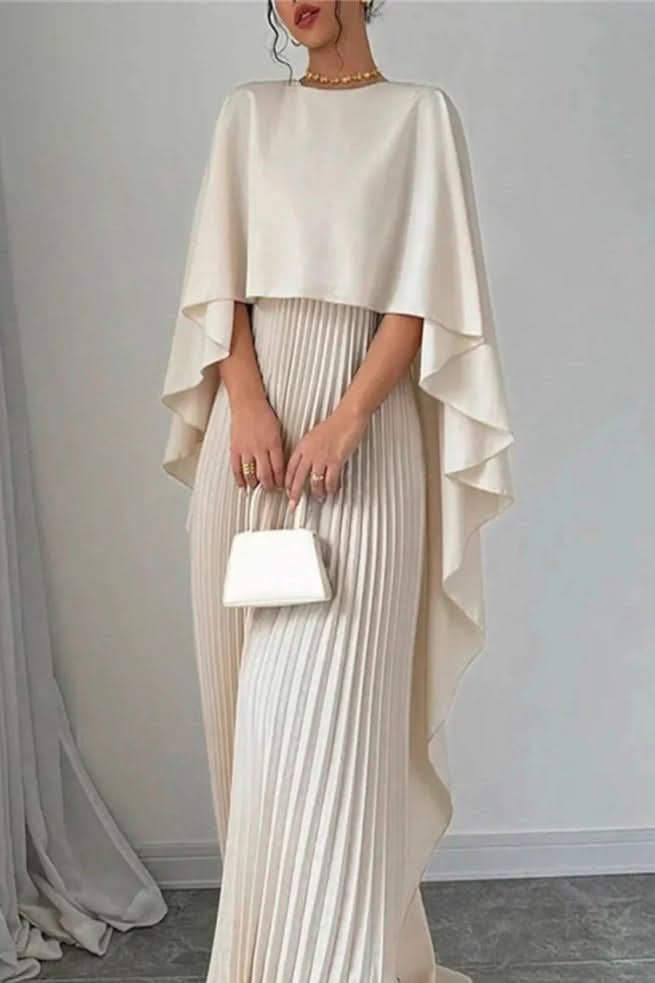 Women's luxurious pleated maxi dress with a sophisticated cape design. A stunning elegant formal gown.