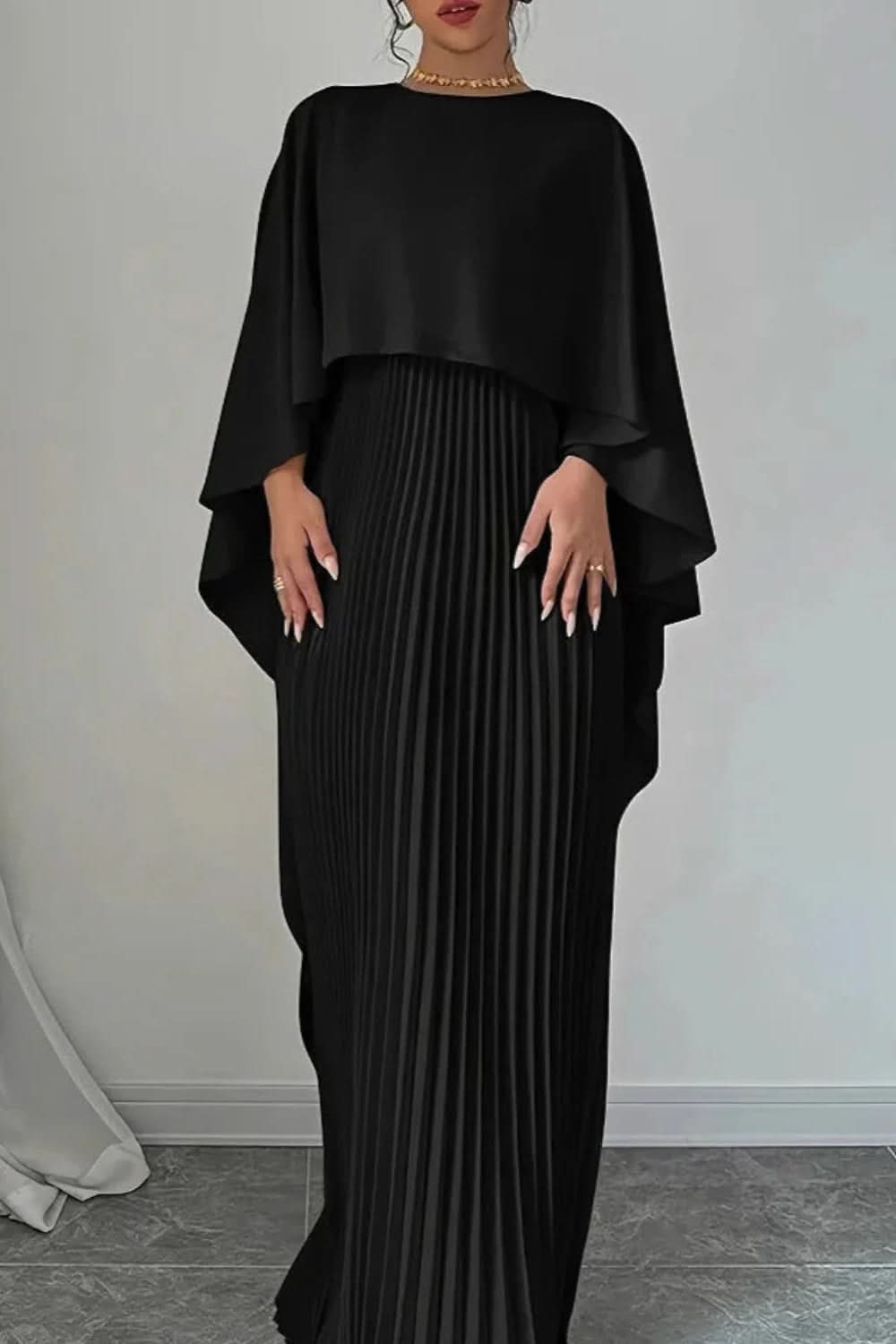 Sophisticated women's pleated cape maxi dress. Elegant long evening gown for formal special occasions.