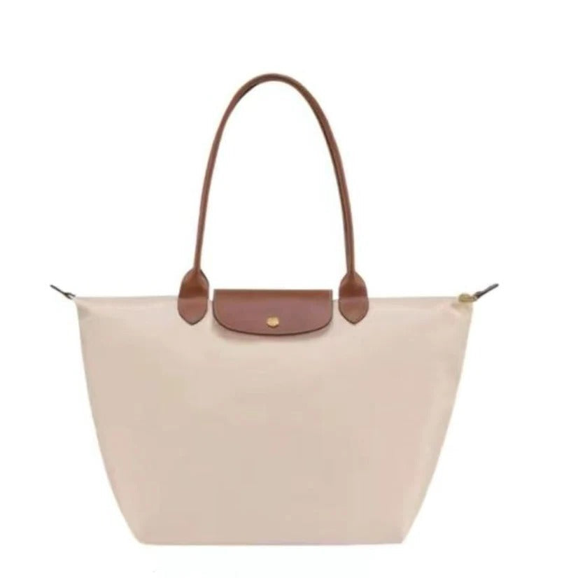 Women's stylish top handle luxury bag. Elegant fashion accessory and practical everyday carry purse.