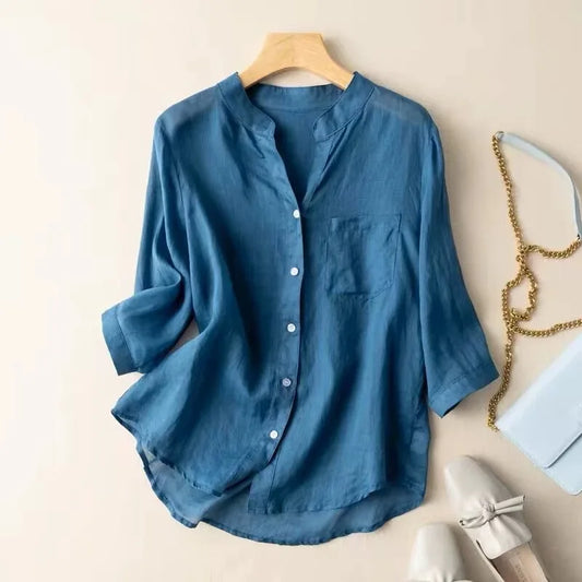Elegant women's mandarin collar blouse, relaxed fit, long sleeves, and pocket detail for versatile everyday style.