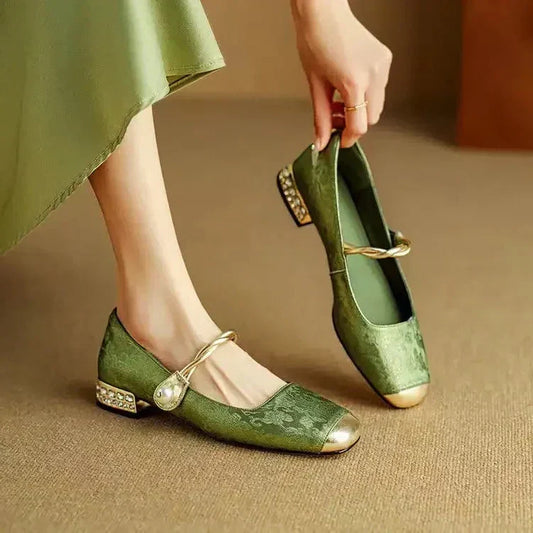 Elegant Women's Mary Jane flats with pearl strap and subtle low heel, perfect for dress or everyday wear.
