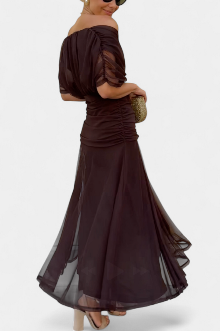 Sleeveless women's evening gown with a flattering pleated waist, perfect for special occasions.