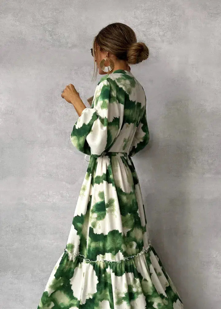 Women's elegant V-neck maxi gown with chic puff sleeves & a flowy tiered skirt, perfect for special occasions.