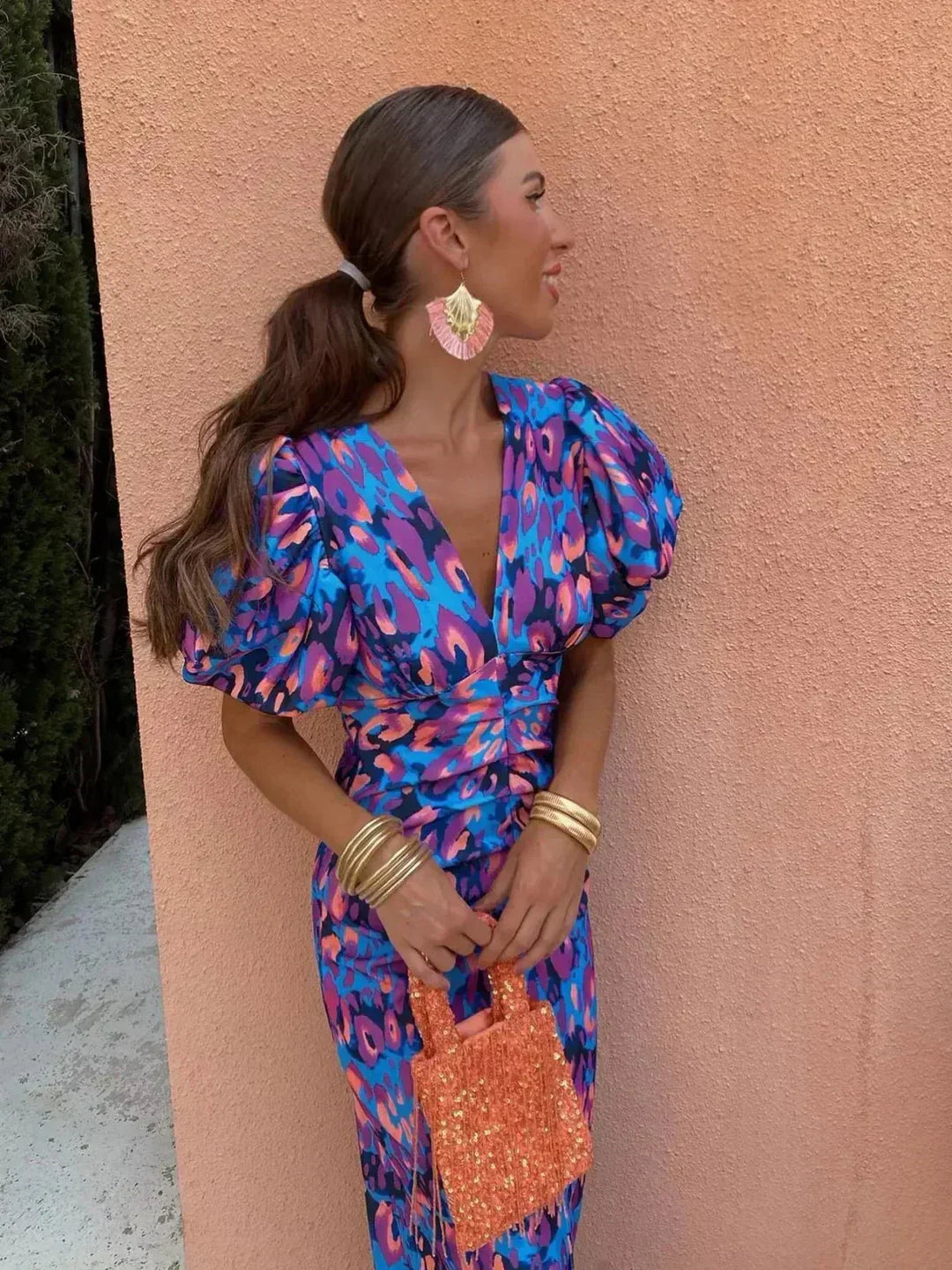 Elegant women's maxi wedding guest dress with chic abstract print, V-neck, and puff sleeves. Perfect for special occasions.