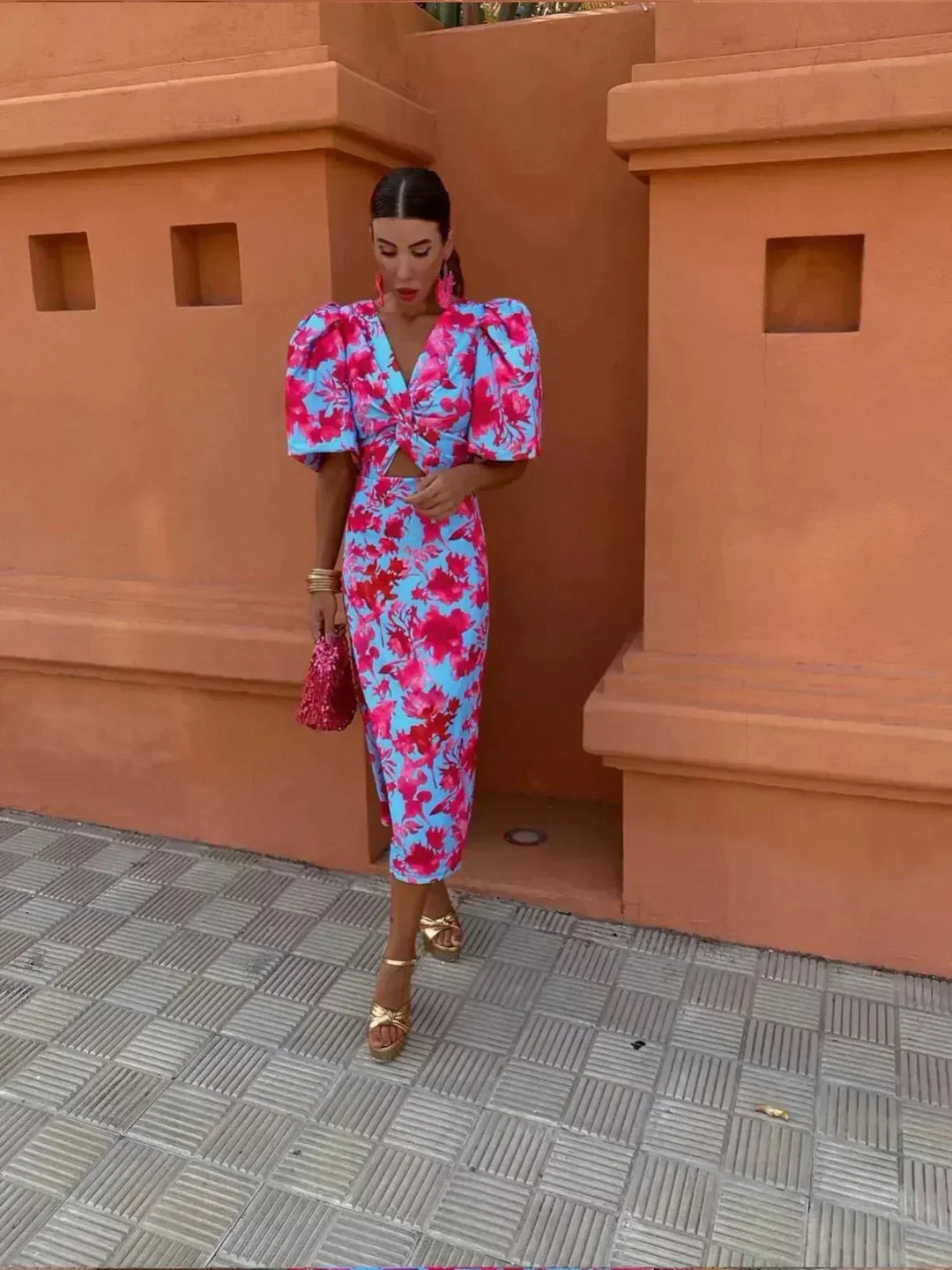 Stylish women's printed maxi dress featuring a V-neck, elegant puff sleeves, and a flattering ruched waist. Ideal for guests.
