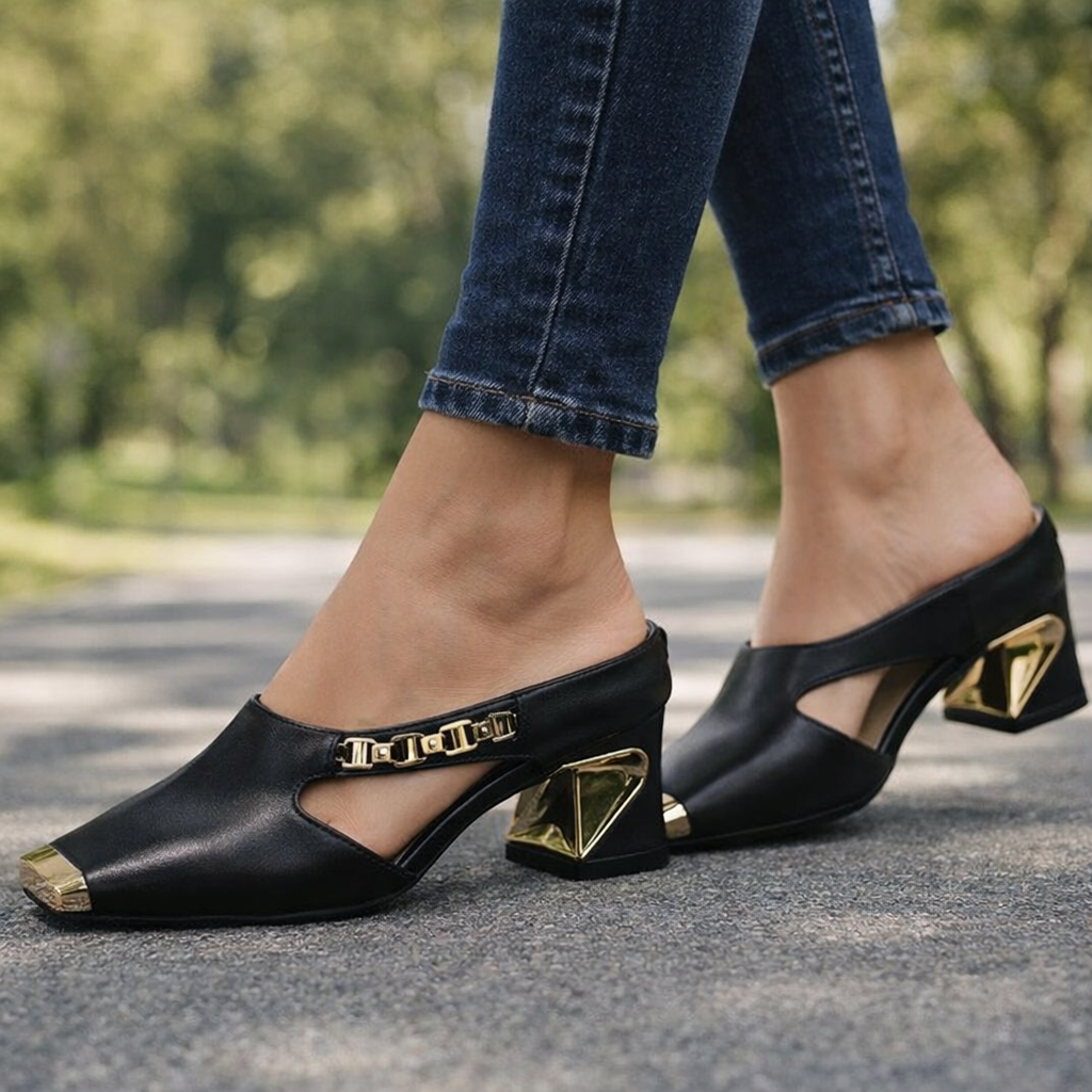 Sleek women's black pointed stiletto heels with a chic gold metallic toe cap. Ideal for parties & dressy occasions.