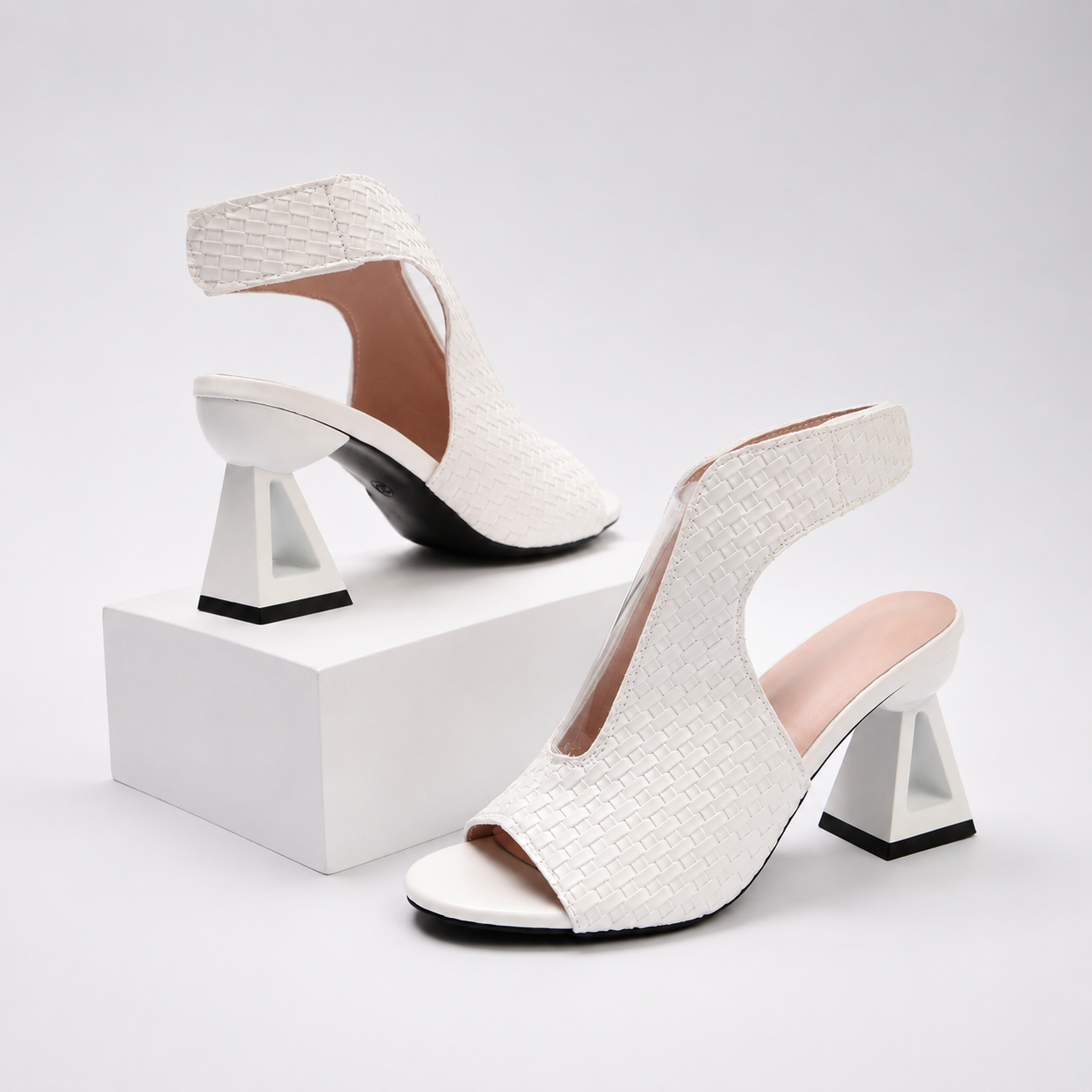 Designer women's fashion heels: metallic weave, open-toe, slingback, and an innovative geometric heel.