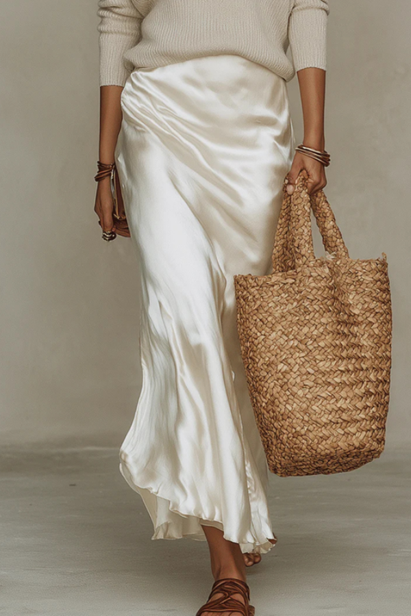 Chic women's midi dress & matching sweater set, ideal for elegant fall or spring layered fashion.