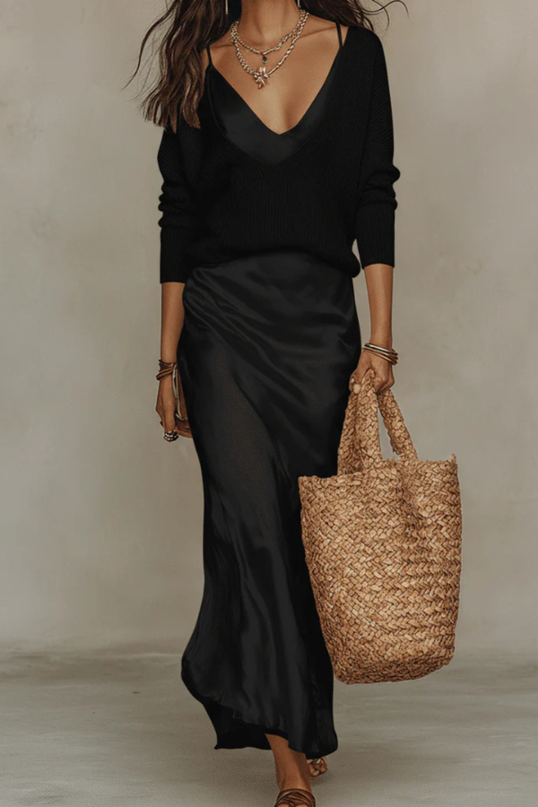Coordinated women's midi dress and sweater set, a versatile two-piece outfit for an elegant layered look.