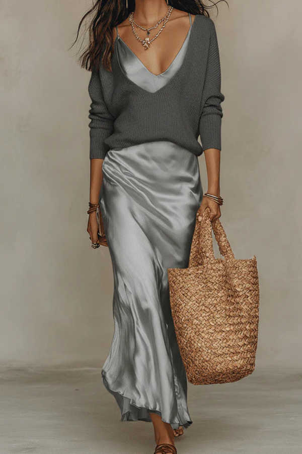 Sophisticated women's midi dress & sweater ensemble, a chic two-piece set for refined layered style.