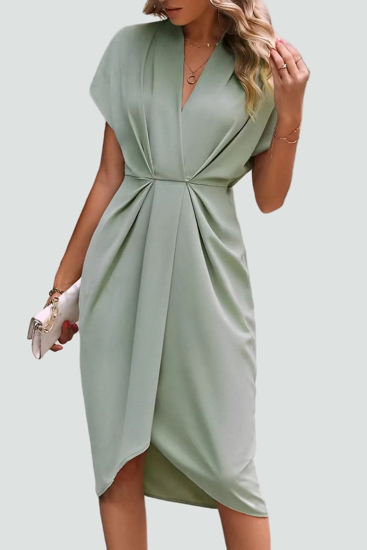 Stylish women's midi wrap dress on a model, featuring a flattering V-neck, ideal for party and cocktail wear.