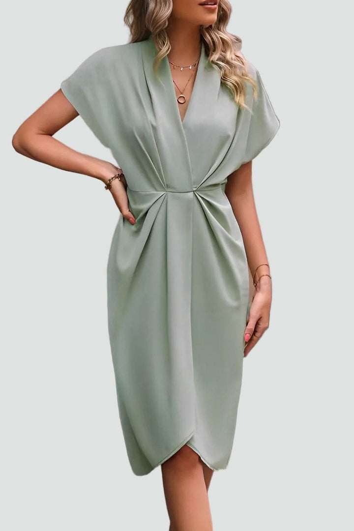 Flattering fit women's midi wrap dress, elegant V-neck design for a sophisticated and versatile style.
