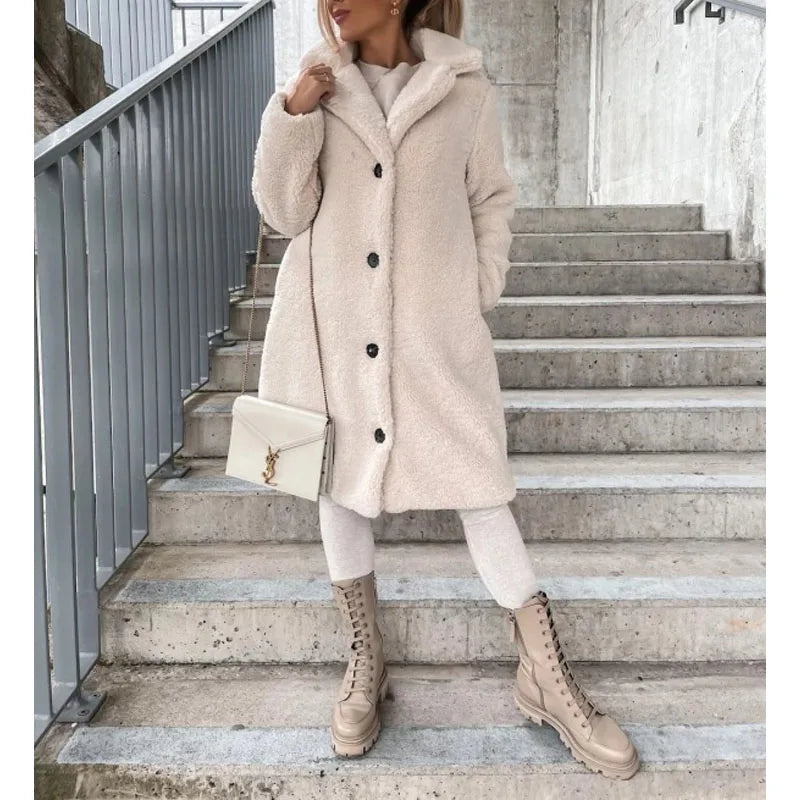 Stylish women's longline winter coat. Versatile Milano outerwear, perfect for a layered, modern fall/winter fashion look.