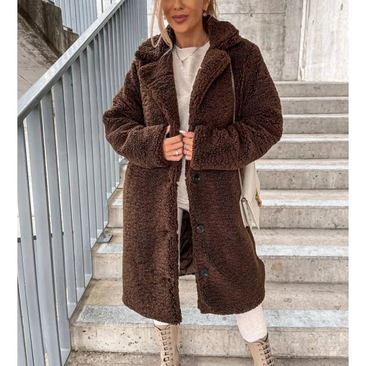 Women's elegant longline winter coat. Perfect warm and stylish outerwear, a cozy jacket for modern fall/winter fashion.