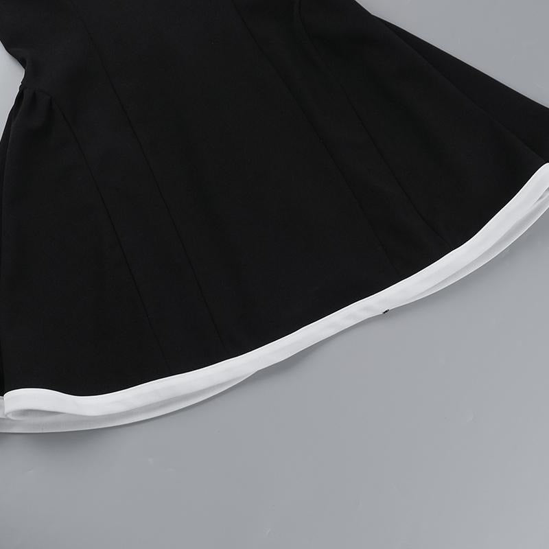 Women's elegant mini dress showcasing a sophisticated contrast neckline, a chic and flattering design.