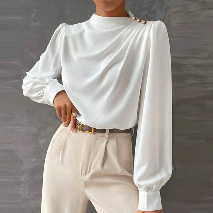 Dressy women's long sleeve mock neck blouse, ruched detail & gold buttons. A versatile top for professional attire.