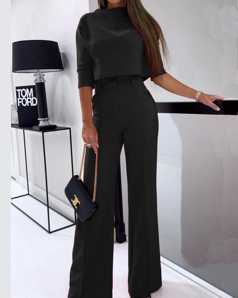 Chic two-piece women's set featuring a stylish top and flowing wide-leg pants, embodying modern minimalist fashion.
