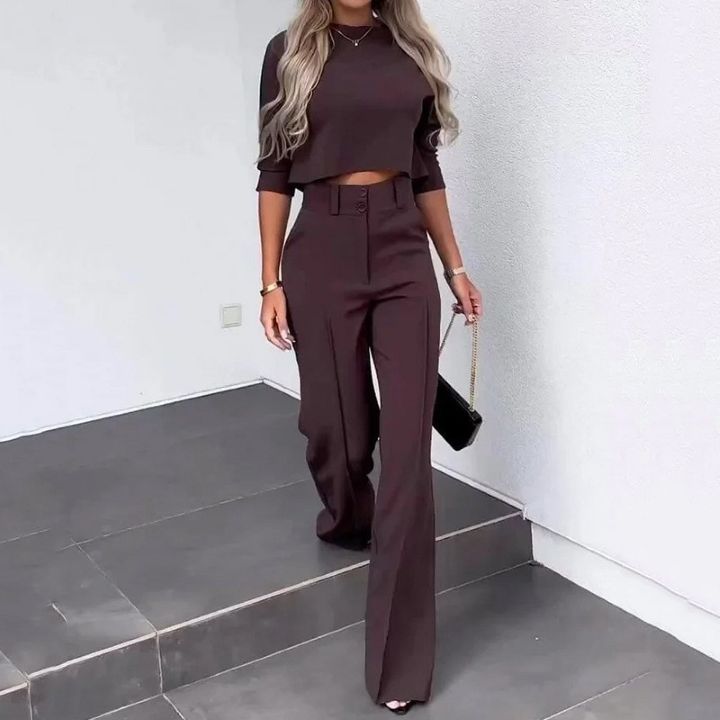 Tailored fit modern two-piece women's set, including a matching top and wide-leg pants, suitable for work or events.