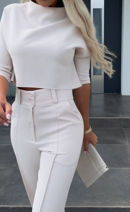 Minimalist modern women's two-piece set, combining an elegant top and comfortable wide-leg pants for versatile style.