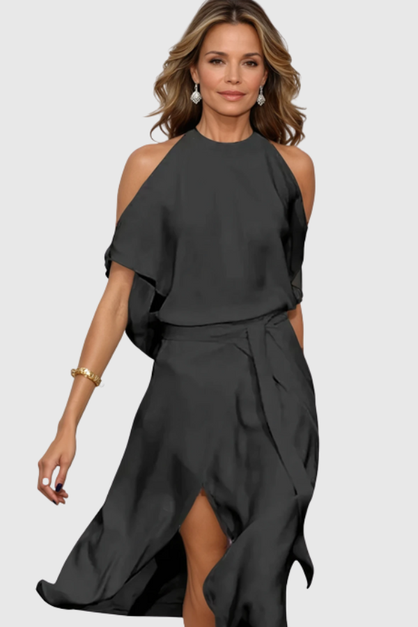 Chic women's off-shoulder midi dress with an asymmetric hem. Elegant fashion for special events and formal gatherings.