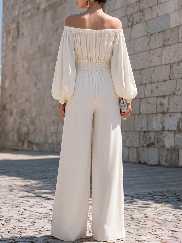 Flowing white off-shoulder maxi dress, ideal for wedding guests, formal events, or elegant summer parties.