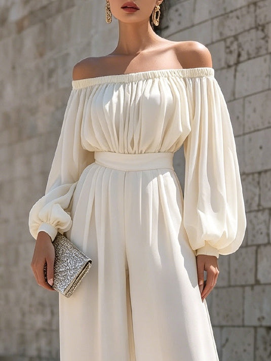 Women's flowing white off-shoulder maxi dress, an elegant long gown with bishop sleeves for special occasions.