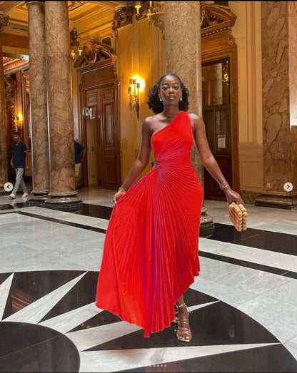 Sleek women's one-shoulder formal evening gown with elegant pleats, a sophisticated choice for special events.