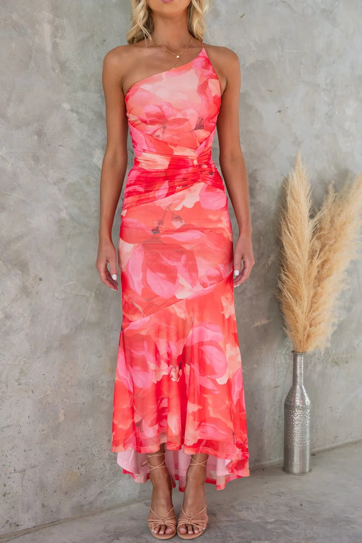 Colorful floral print one-shoulder maxi dress, ruched for an elegant look. Ideal wedding guest attire.