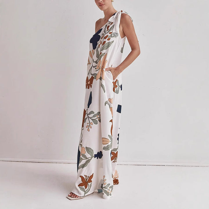 Flowy one-shoulder maxi dress for women with vibrant floral print, ideal for beach, resort, or summer events.
