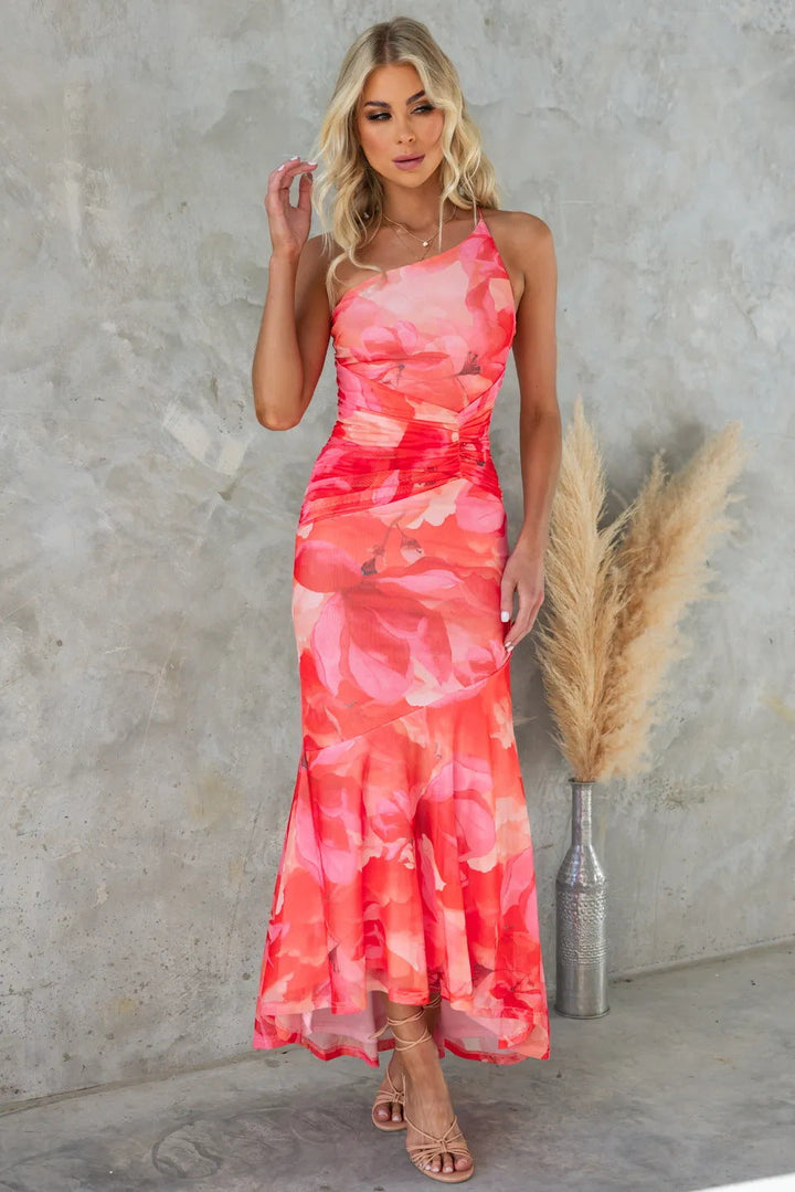 Women's formal one-shoulder maxi dress with a colorful floral print. Perfect elegant wedding guest attire.