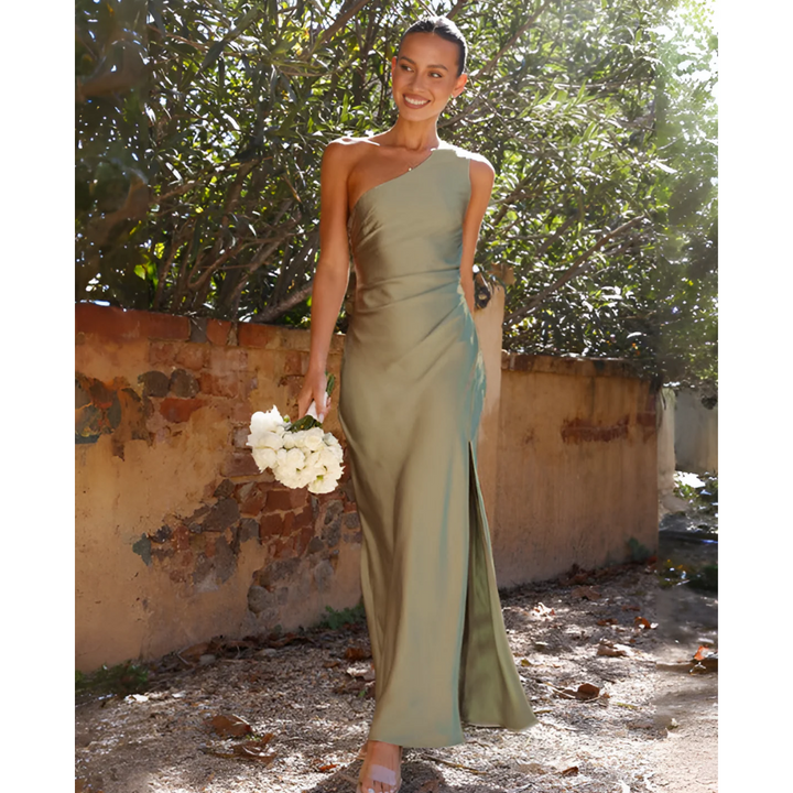 Elegant women's one-shoulder green maxi dress with a stylish side slit, perfect for formal events & parties.