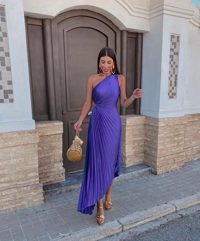 Elegant women's one-shoulder pleated maxi dress, perfect for a wedding guest or formal evening event.