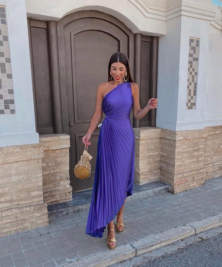 Elegant women's one-shoulder pleated maxi dress, perfect for a wedding guest or formal evening event.