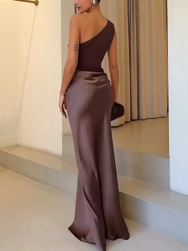 Flowing one-shoulder pleated maxi dress for women. Elegant party gown, perfect for formal evening events.