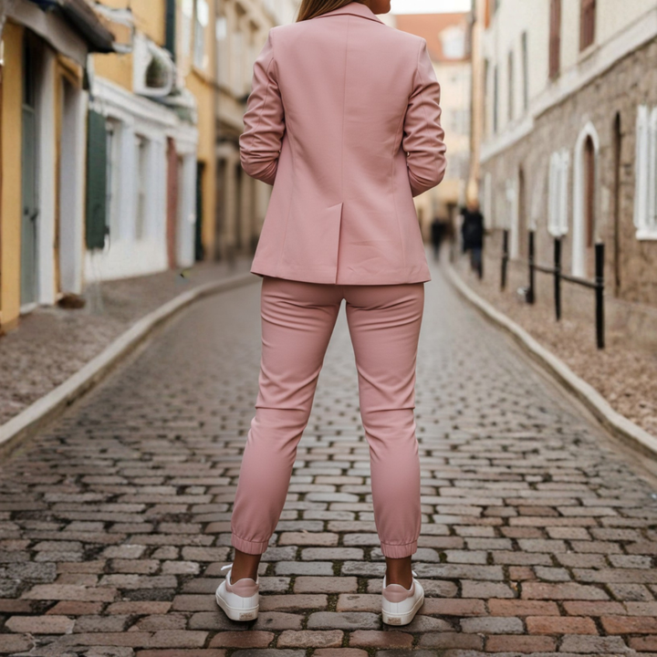 Stylish pink women's two-piece set: open front blazer with ruched sleeves & tailored joggers.