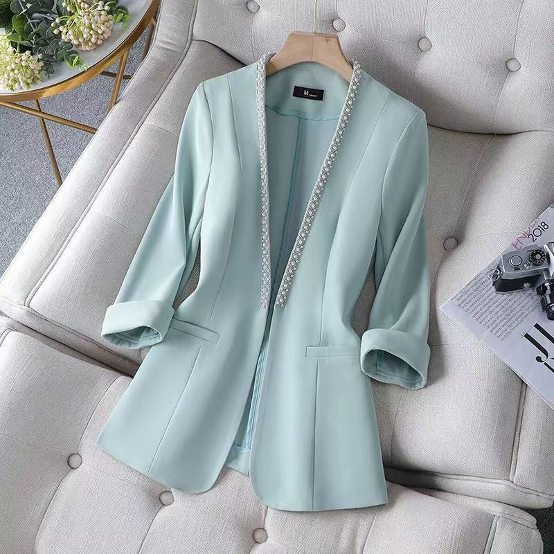 Stylish women's open front blazer featuring elegant pearl trim, ideal for versatile fashion & sophisticated looks.