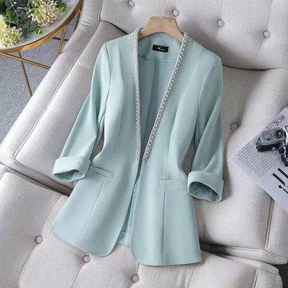 Stylish women's open front blazer featuring elegant pearl trim, ideal for versatile fashion & sophisticated looks.