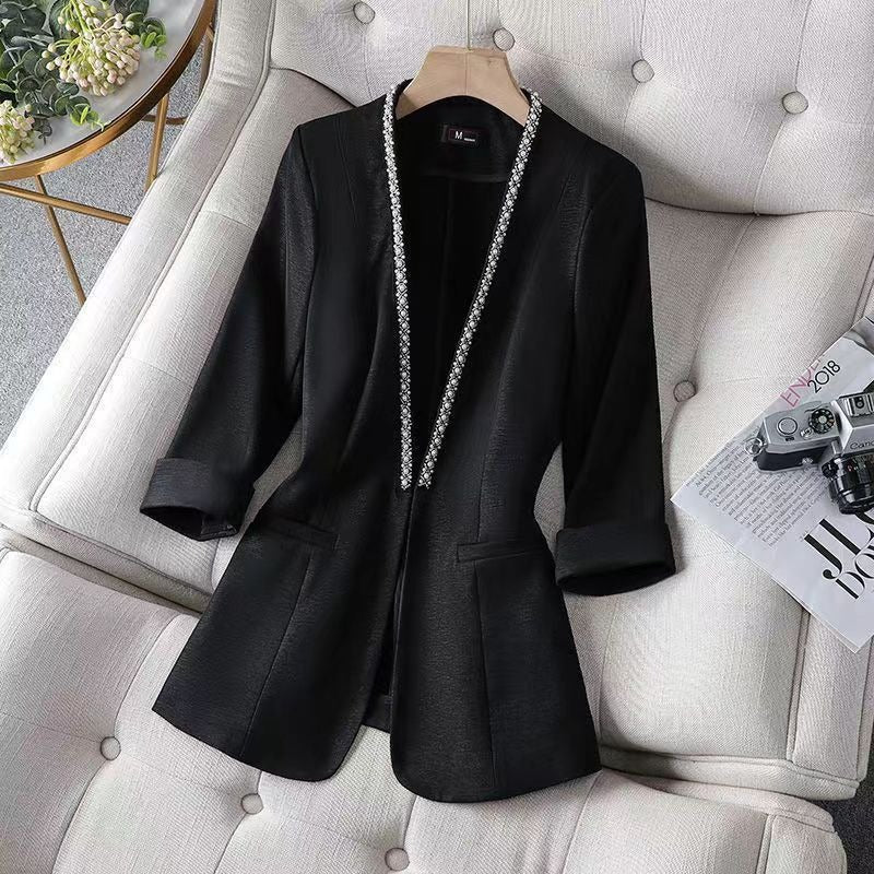 Chic women's open front blazer with beautiful pearl trim details. A formal blazer for elegant professional wear.
