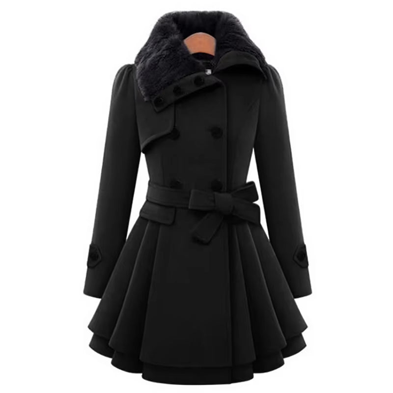 Close-up of a women's double-breasted overcoat, highlighting the soft faux fur collar & layered hem detail.