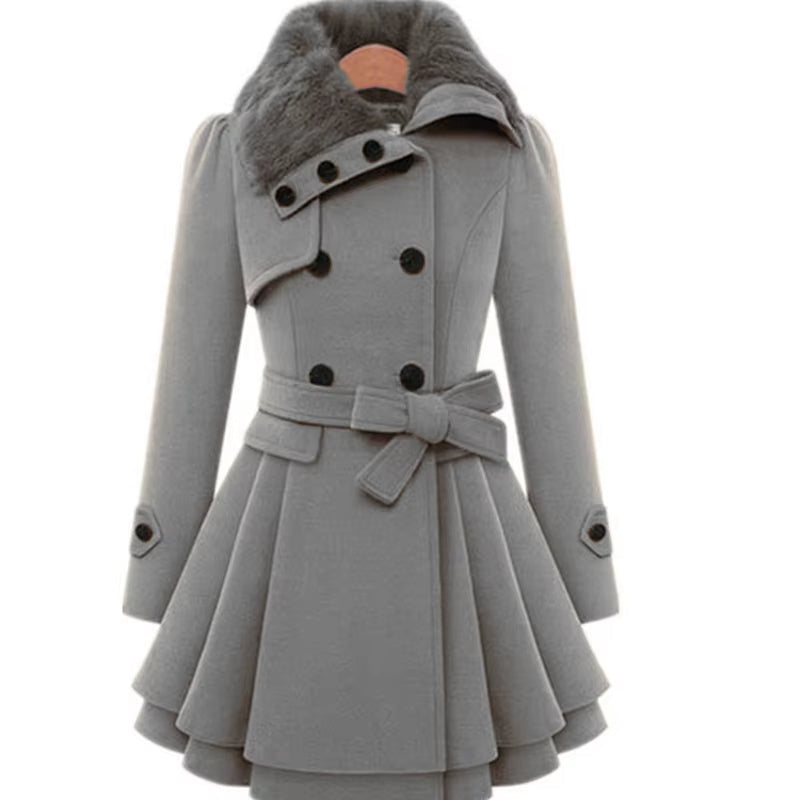 Full shot of a women's elegant belted overcoat with luxurious faux fur collar & layered hem.