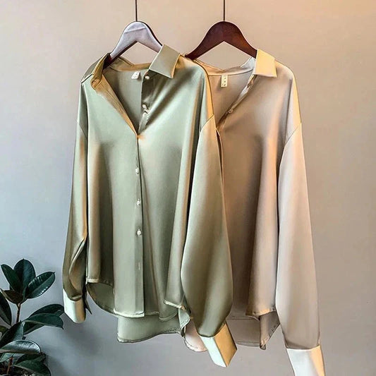 Elegant women's oversized button-down shirt, long sleeve, flowy fabric. Perfect for chic workwear or casual luxury.